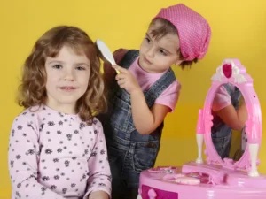 A girl is putting makeup on another girl