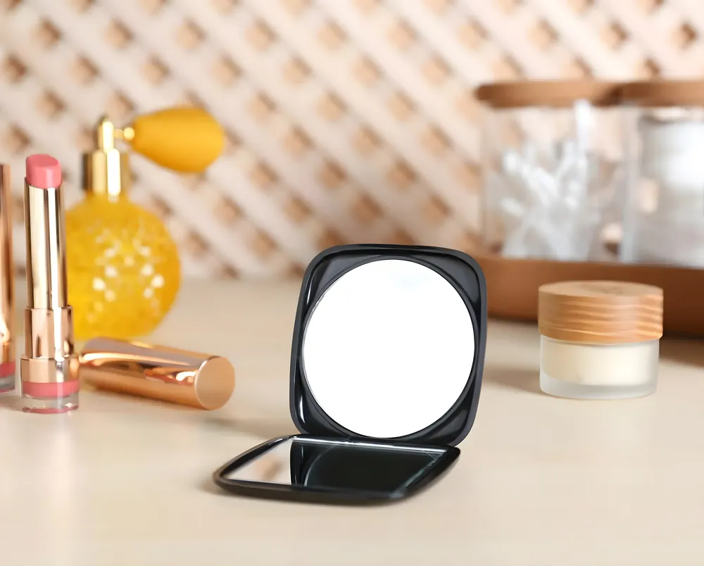 Double-sided pocket mirror with a unique shape