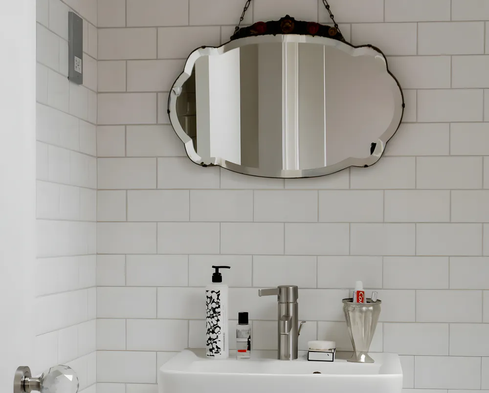 Hanging mirror above the sink