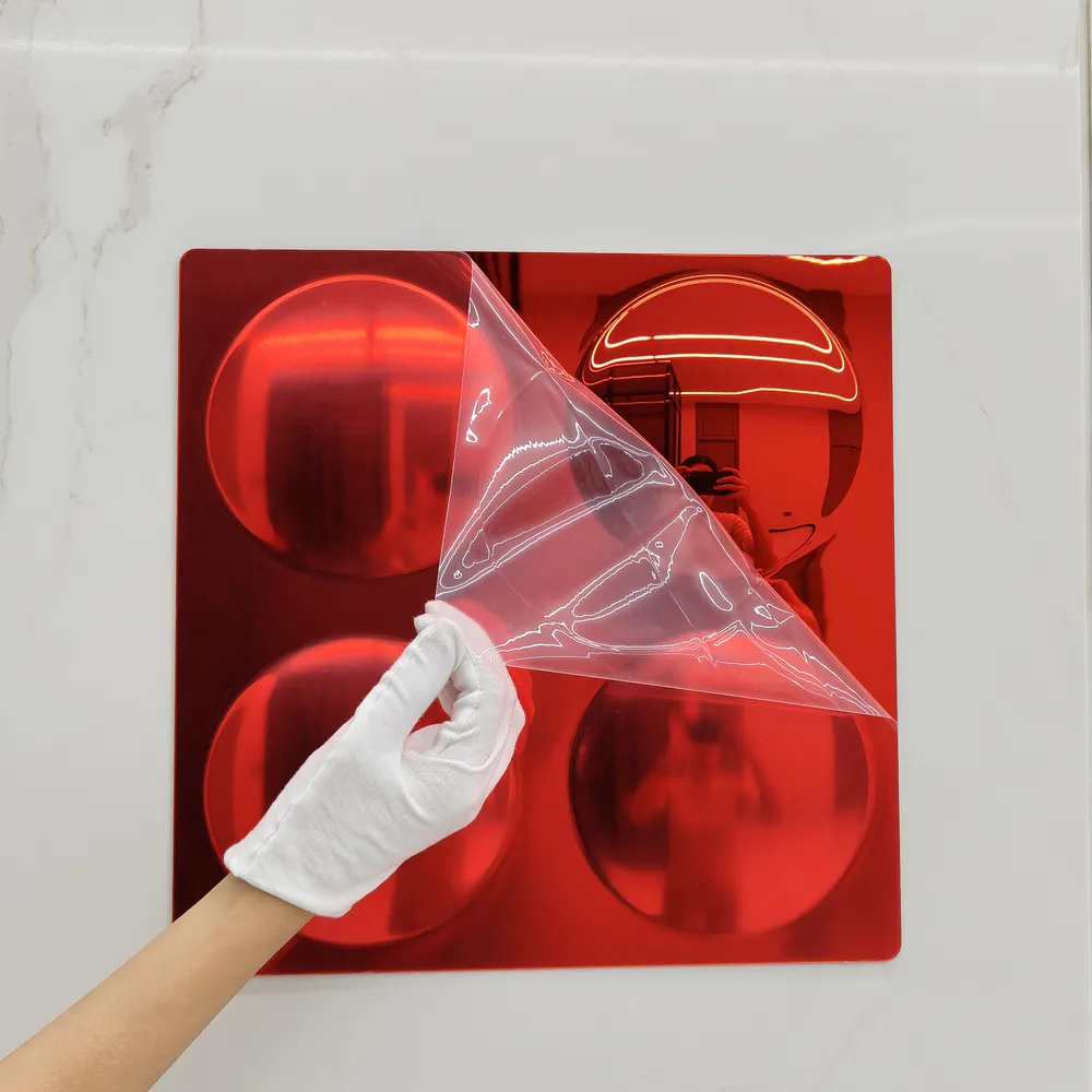 Image of a green four-in-one bubble mirror with the protective film torn open