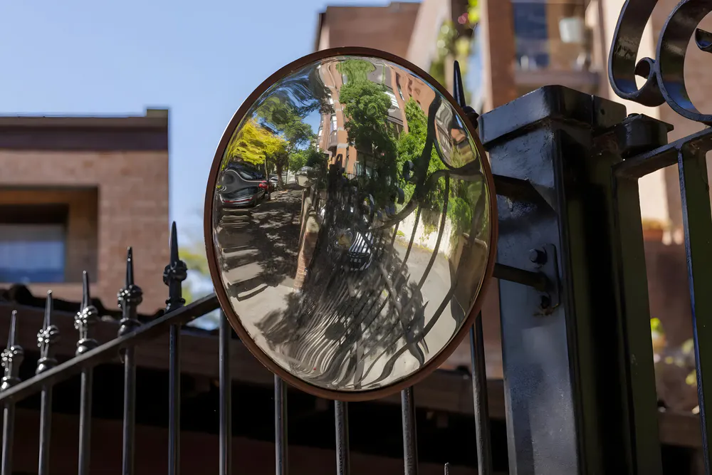 Traffic mirror at the entrance to a private residence