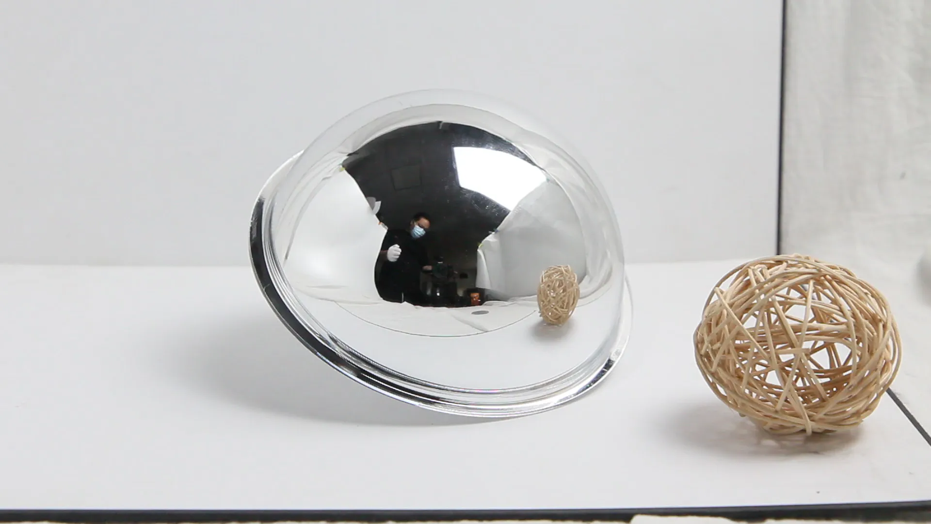 Video cover showing the use of a handheld acrylic dome mirror for effect shots