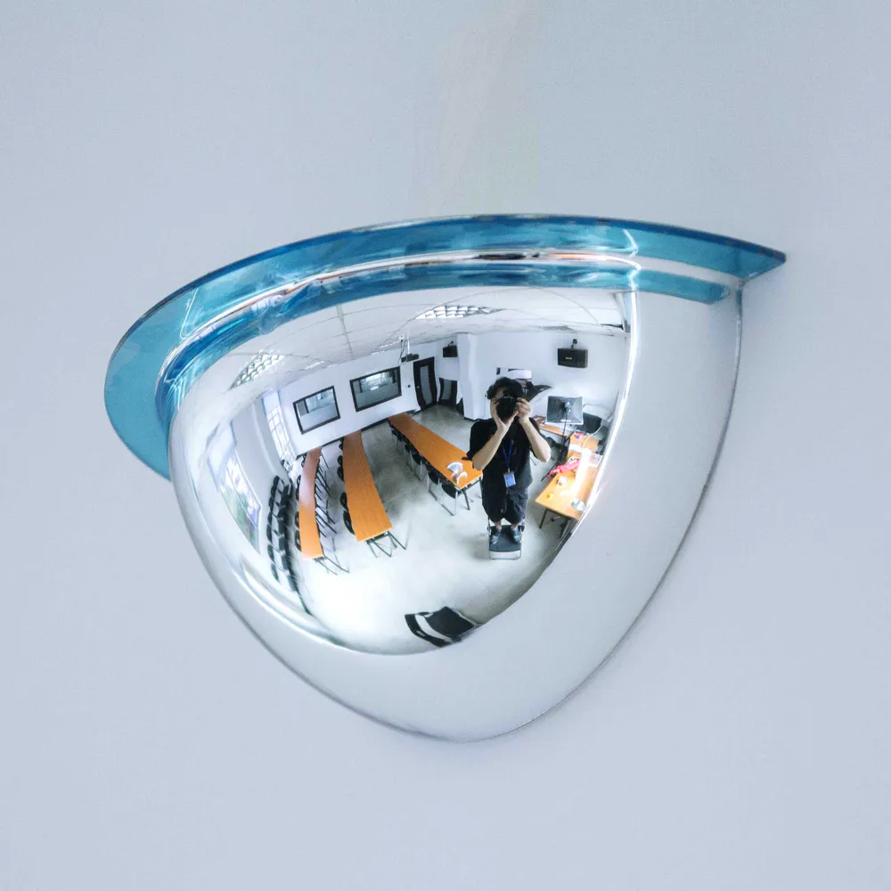 Quarter dome mirror mounted on a right-angle wall