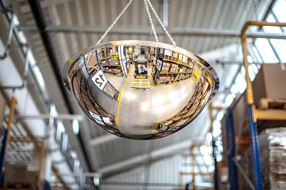 The dome-shaped mirror hanging above the warehouse