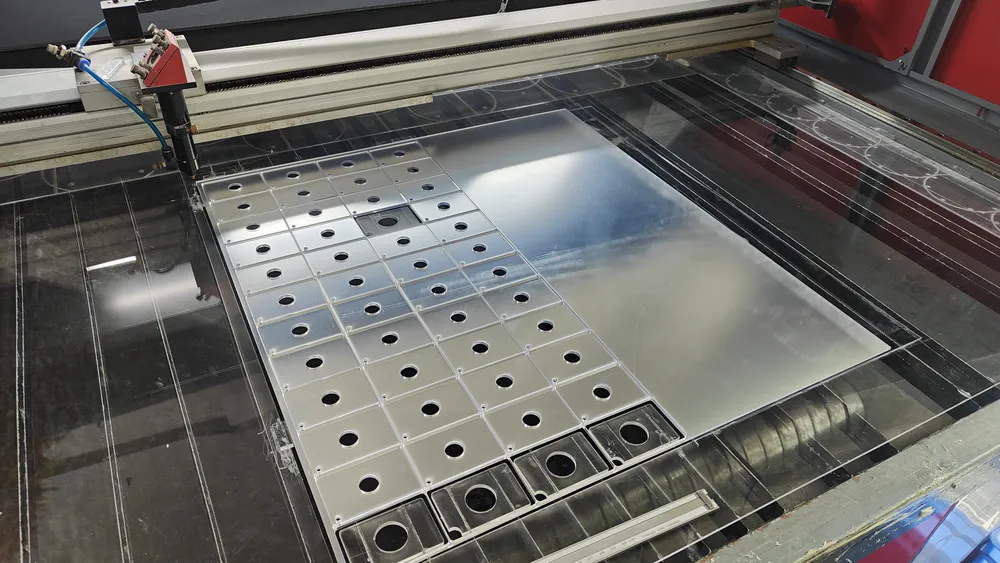 Use a laser cutting machine to cut mirror sheet material into small mirror pieces