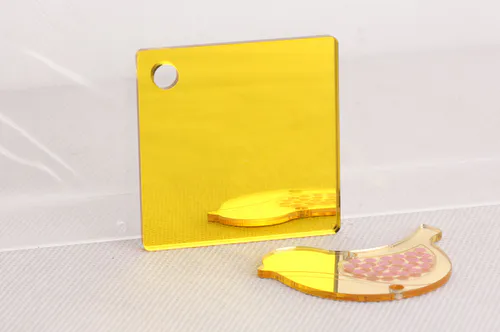 gold-colored acrylic mirror