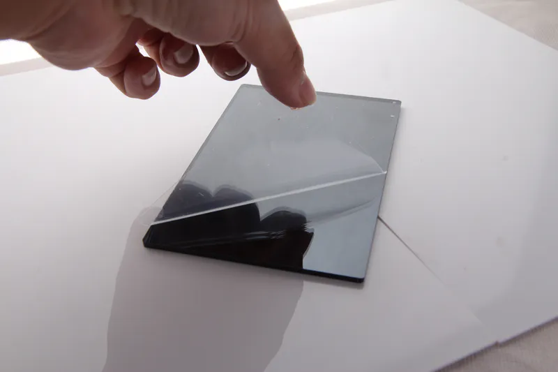 A small black acrylic mirror sample