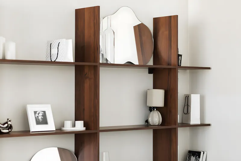 Leaning wall decorative mirror on the display shelf