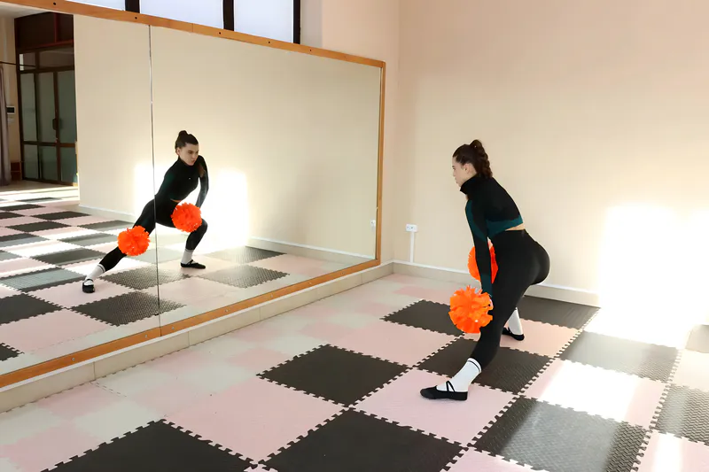 The full-length mirror inside the dance studio