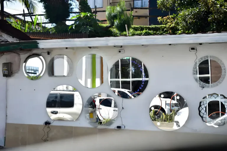 Decorative mirror on the garden wall