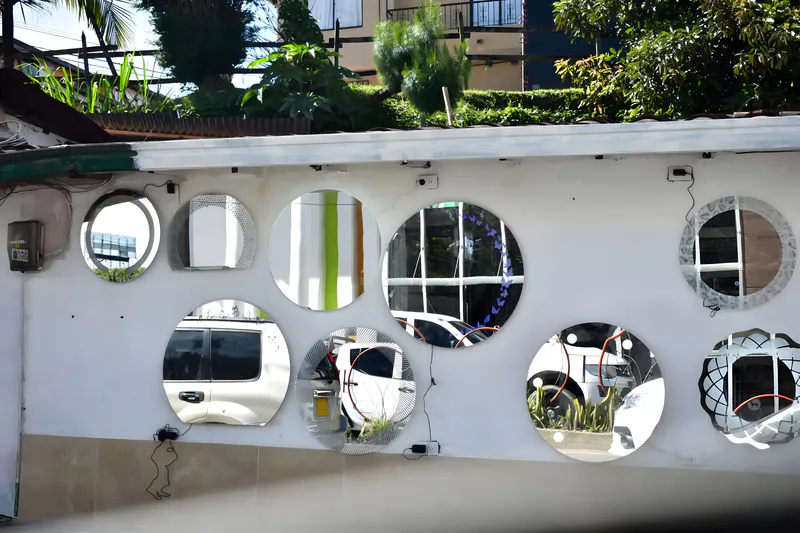 Decorative mirror on the garden wall