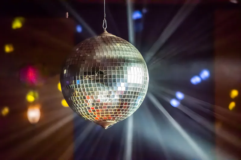 A disco mirror ball hanging from the ceiling