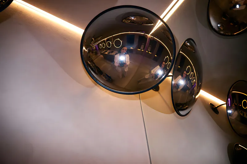 The indoor convex mirror in the corner of the restroom