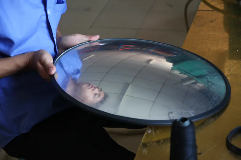 Workers inspecting the convex mirror